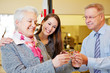 Elderly woman buying glasses