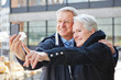 Senior people taking photos with smartphone