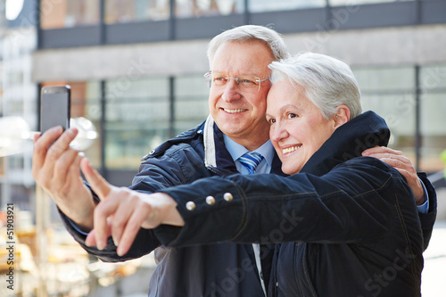 Photo: Senior people taking photos with smartphone Senior people taking photos with smartphone