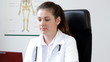 Portrait of beautiful female doctor in office - tracking shot