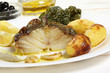 roasted cod fish dish on a table