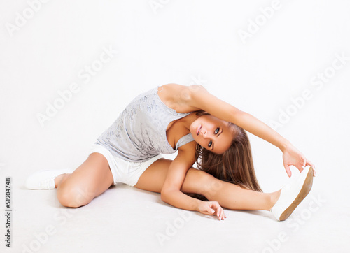 Photo: beautiful Woman stretching muscles beautiful Woman stretching muscles