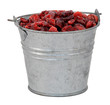 Dried cranberries in a miniature metal bucket