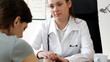 Female doctor comunicate bad news - tracking shot