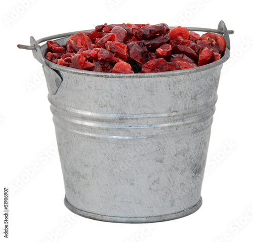 Photo: Dried cranberries in a miniature metal bucket Dried cranberries in a miniature metal bucket