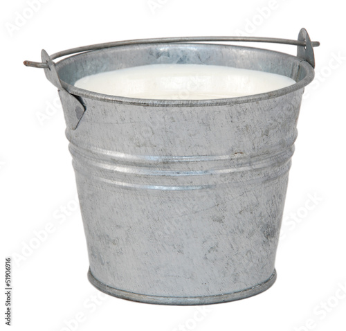 Photo: Milk in a miniature metal bucket Milk in a miniature metal bucket