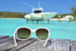 Sunglasses on the wooden jetty. Exuma, Bahamas