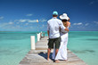 A couple on the wooden jetty. Exuma, Bahamas