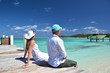 A couple on the wooden jetty. Exuma, Bahamas