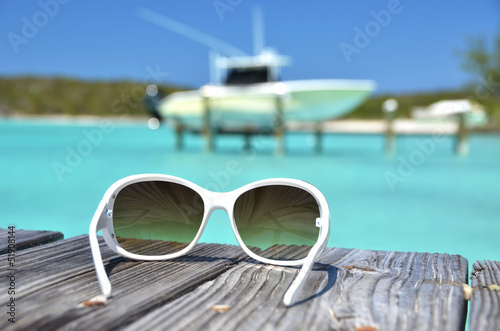 Photo: Sunglasses on the wooden jetty. Exuma, Bahamas Sunglasses on the wooden jetty. Exuma, Bahamas