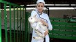 vet listens to a stethoscope lamb