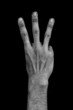 Hand on black back - three