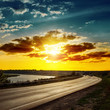 good sunset over asphalt road
