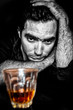 Grunge portrait of a drunk and depressed hispanic man