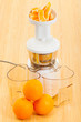 slow juicer making orange juice