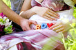 Portrait of  pregnant woman with boy cubes on her belly and of h