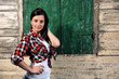 Photo: pretty young girl in front of old house pretty young girl in front of old house