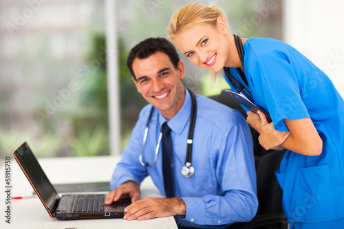 Photo: happy medical nurse and doctor in office happy medical nurse and doctor in office