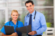 Foto: medical doctor and young female nurse medical doctor and young female nurse