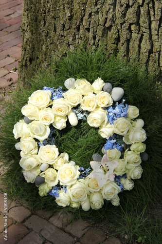 Photo: White roses on a sympathy wreath White roses on a sympathy wreath