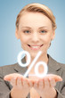 woman showing sign of percent in her hands