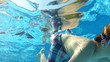 Two Boys Swimming Underwater Together