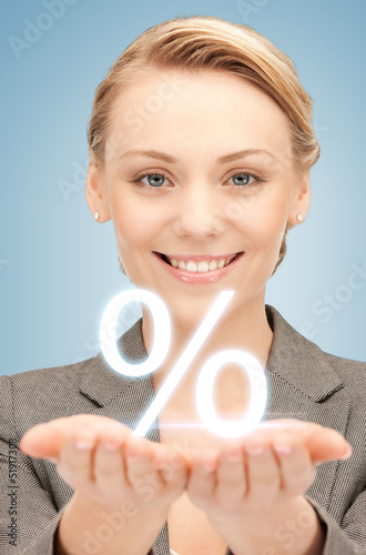 Photo: woman showing sign of percent in her hands woman showing sign of percent in her hands