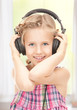 Photo: happy girl in big headphones happy girl in big headphones
