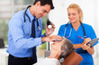 ophthalmologist examining senior woman's eye