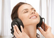 happy teenage girl in big headphones