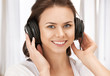 happy teenage girl in big headphones