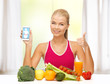 woman with fruits, vegetables and smartphone