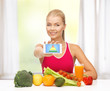 woman with fruits, vegetables and smartphone