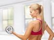 woman with heavy steel dumbbell