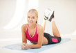 sporty woman doing exercise on the floor