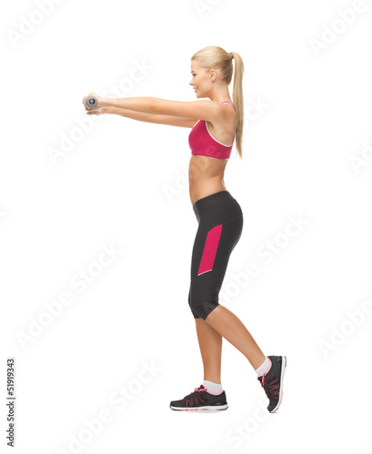 Photo: young sporty woman with light dumbbells young sporty woman with light dumbbells