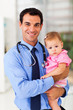 pediatric doctor holding baby girl