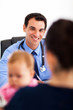 pediatrician talking to baby's mother
