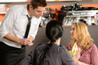 Photo: Waiter taking orders from young woman customer Waiter taking orders from young woman customer