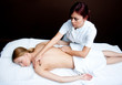 woman having chiropractic back adjustment