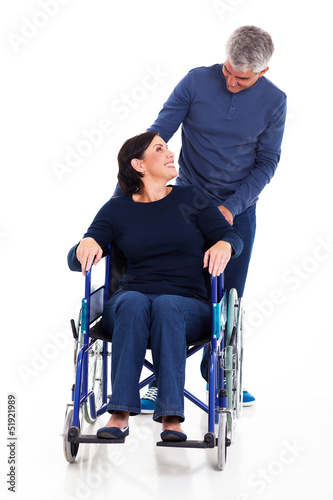 Photo: mature man talking to disabled wife mature man talking to disabled wife