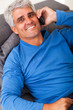 middle aged man talking on mobile phone