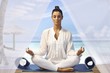 Beautiful woman practicing yoga on the beach