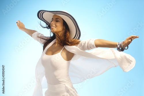 Photo: Attractive woman in sun and wind Attractive woman in sun and wind