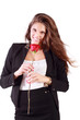Smiling woman in suit holds red rose isolated on white