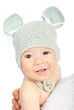 Smiling baby boy in knitted mouse cap
