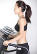 Asian girl slim body likes to run in the simulator