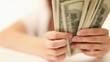 Female hand count the money