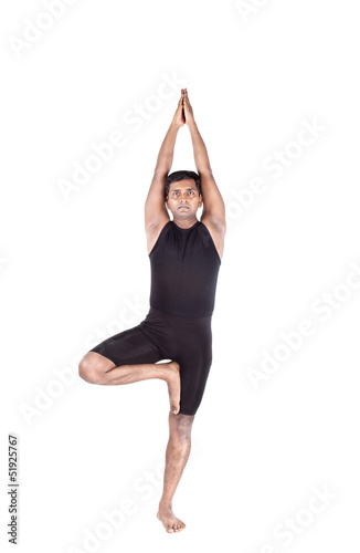 Photo: Yoga tree pose on white Yoga tree pose on white