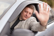 The man at the wheel the grey car